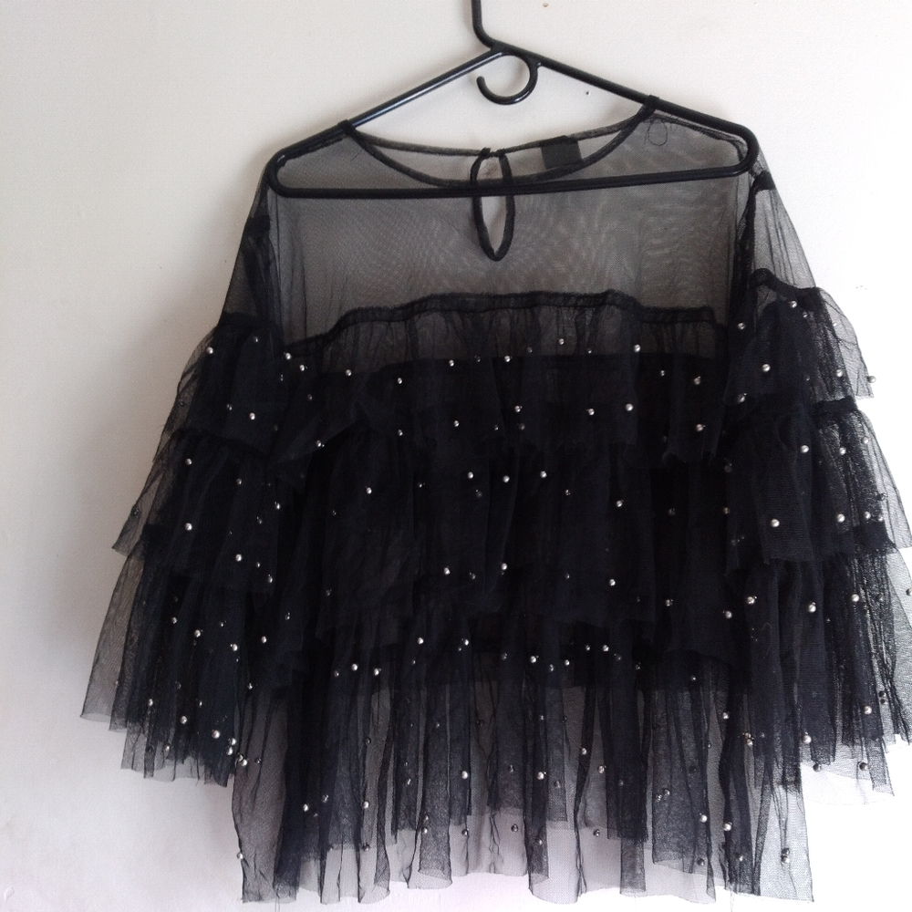 A black sher  with silver dots see threw size 3xs